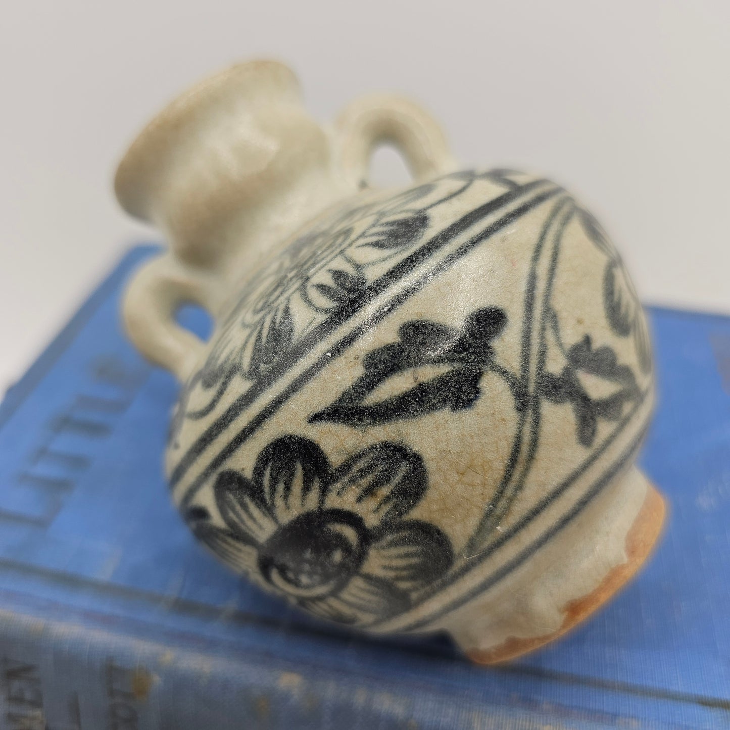 Small Pottery Vase with Flowers and Blue Handles