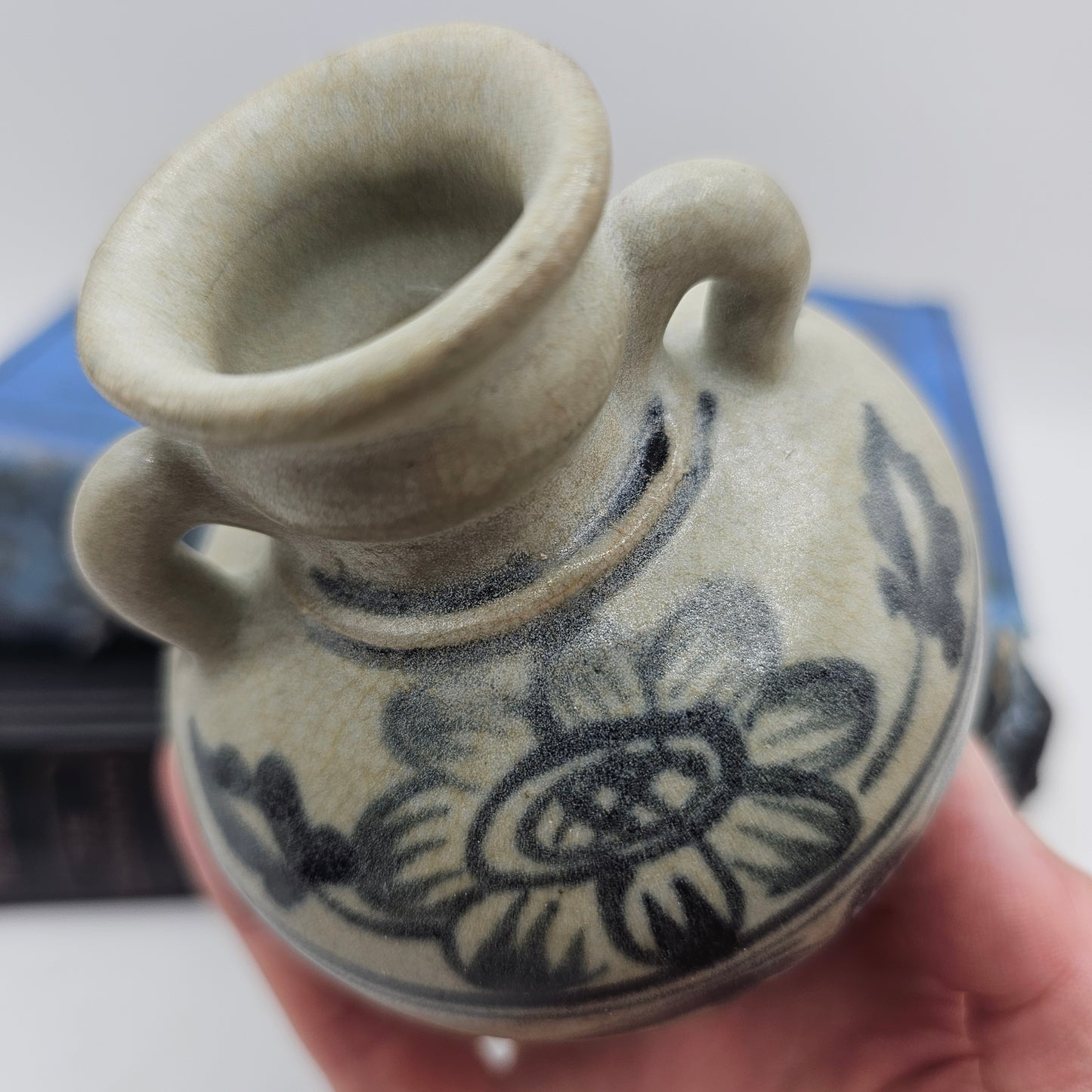 Small Pottery Vase with Flowers and Blue Handles