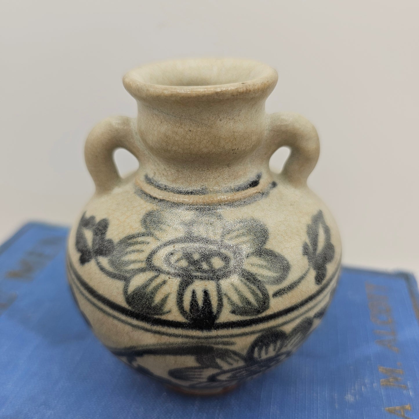 Small Pottery Vase with Flowers and Blue Handles